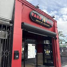 Taco Mell restaurant storefront on Crenshaw Boulevard in Los Angeles — red building with iconic signage