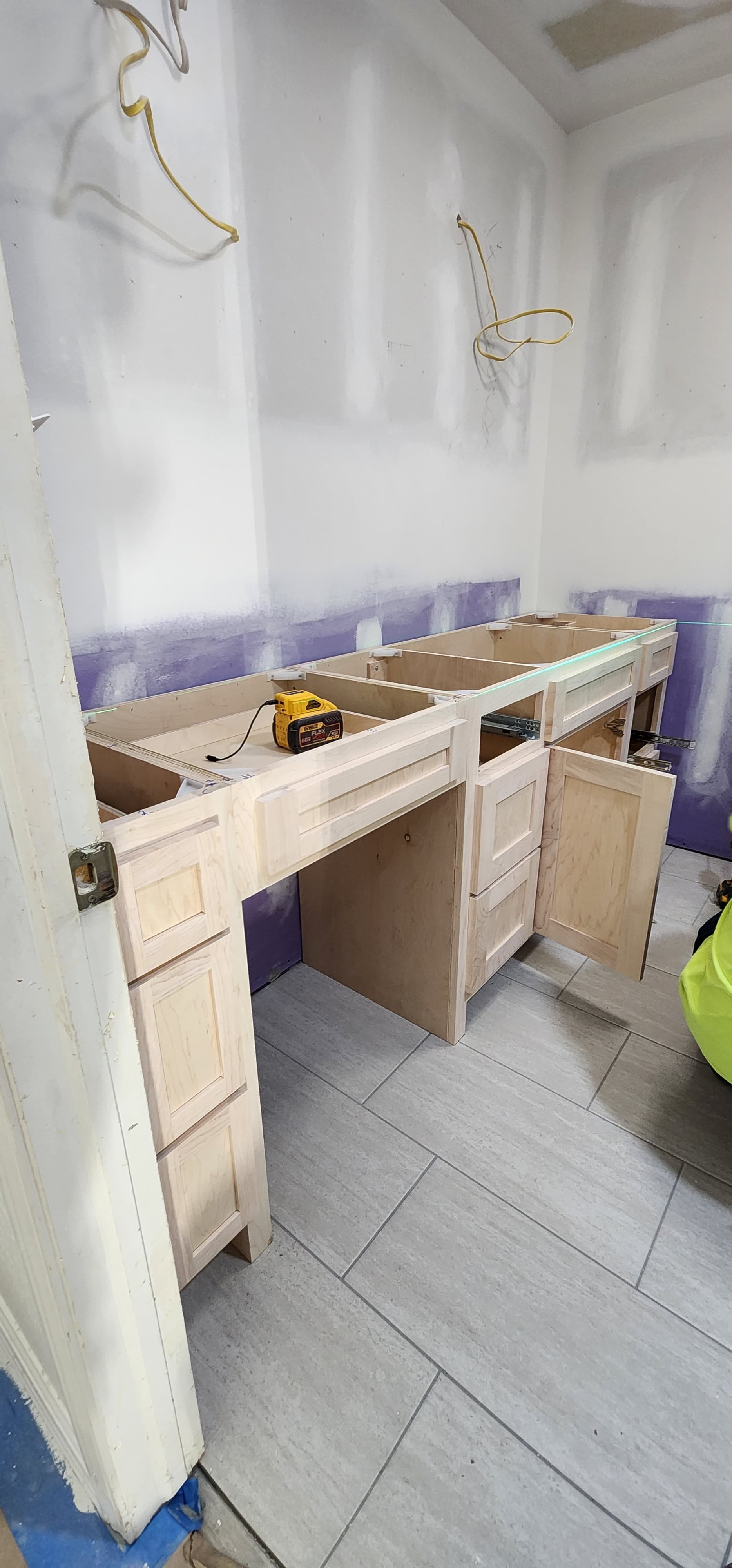 Custom vanity framing and cabinet installation in progress