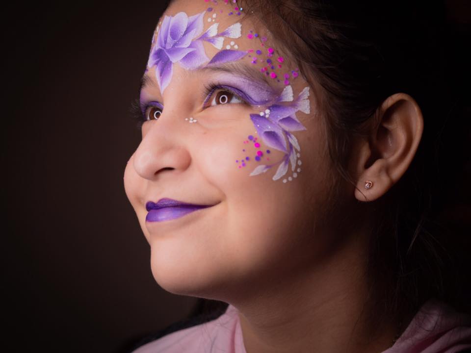 Detailed face painting artwork by Abril Rangel in Houston