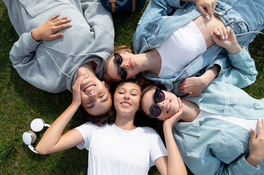 Friends laying on grass