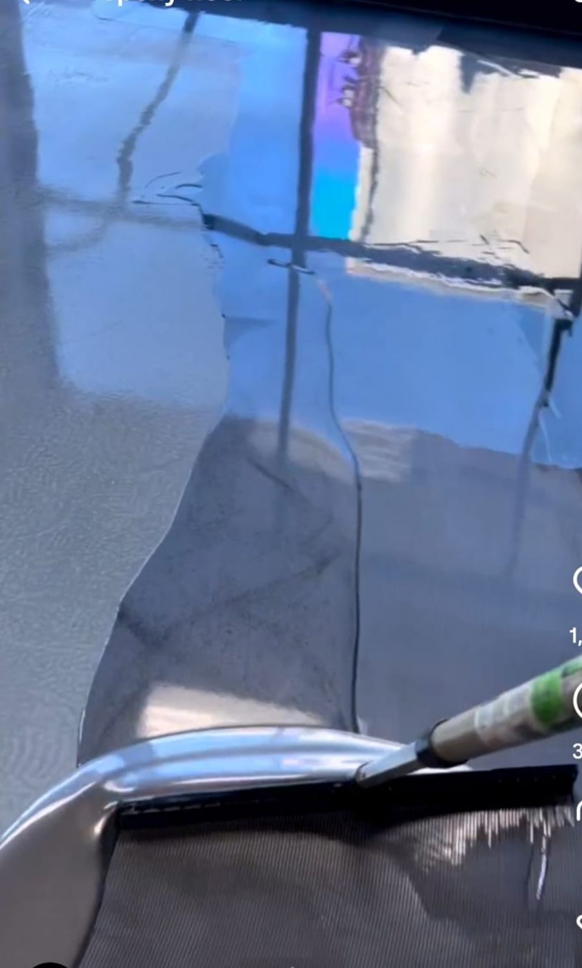 Spreading Epoxy Garage Floor Coating