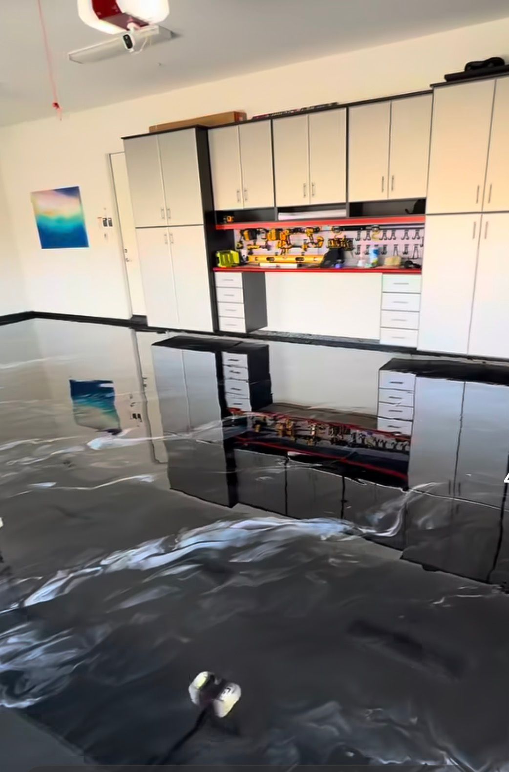 Full garage remodel with epoxy flooring and custom cabinets completed in Draper Utah by Alta Home Group