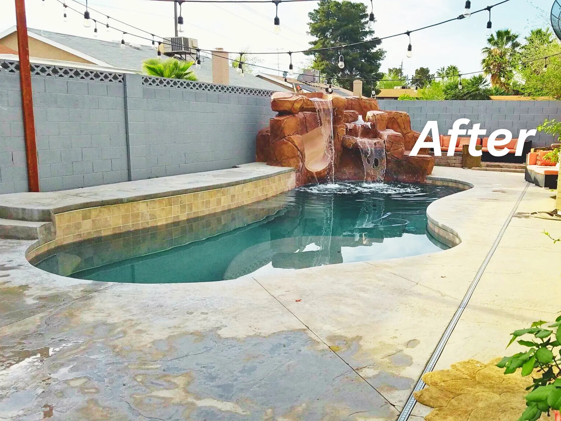 After pool renovation with rock waterfall