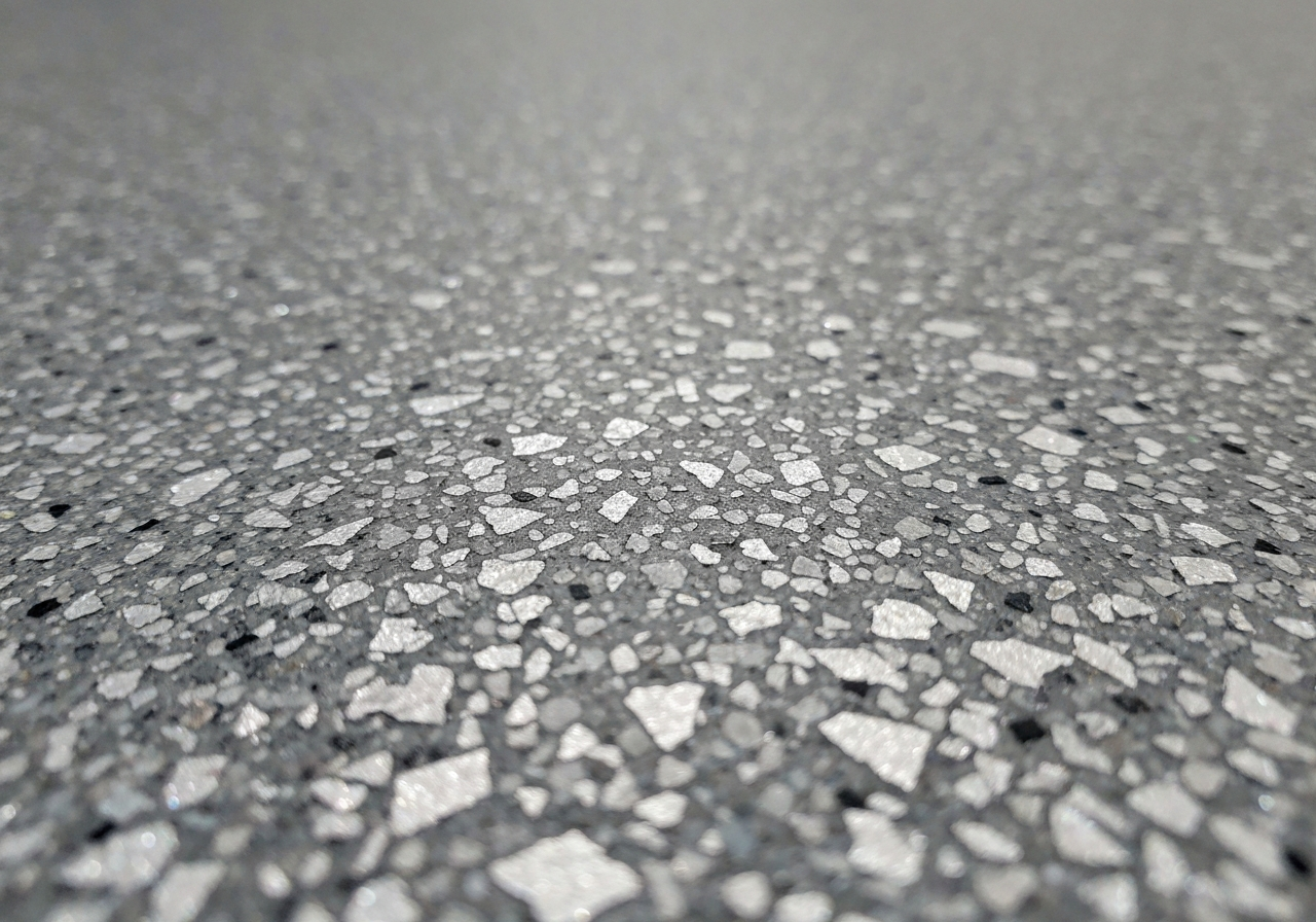Close up of premium MicroQuartz and decorative flake floor finish