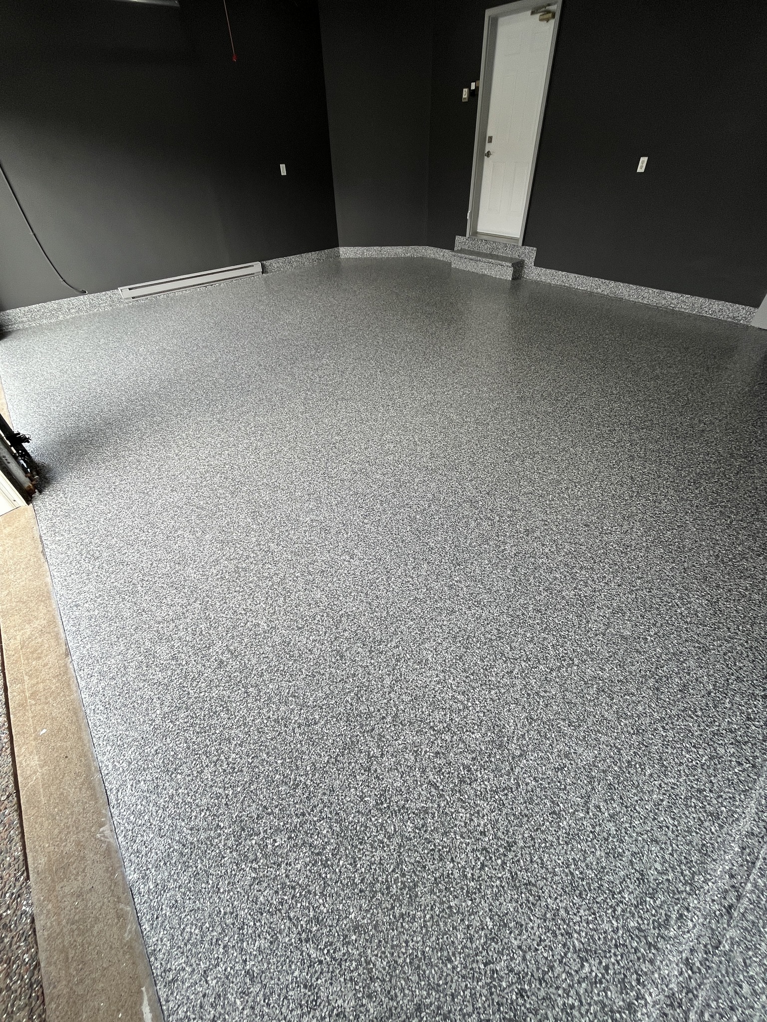 After: Clean, durable, premium flake epoxy garage floor transformation on the Gold Coast