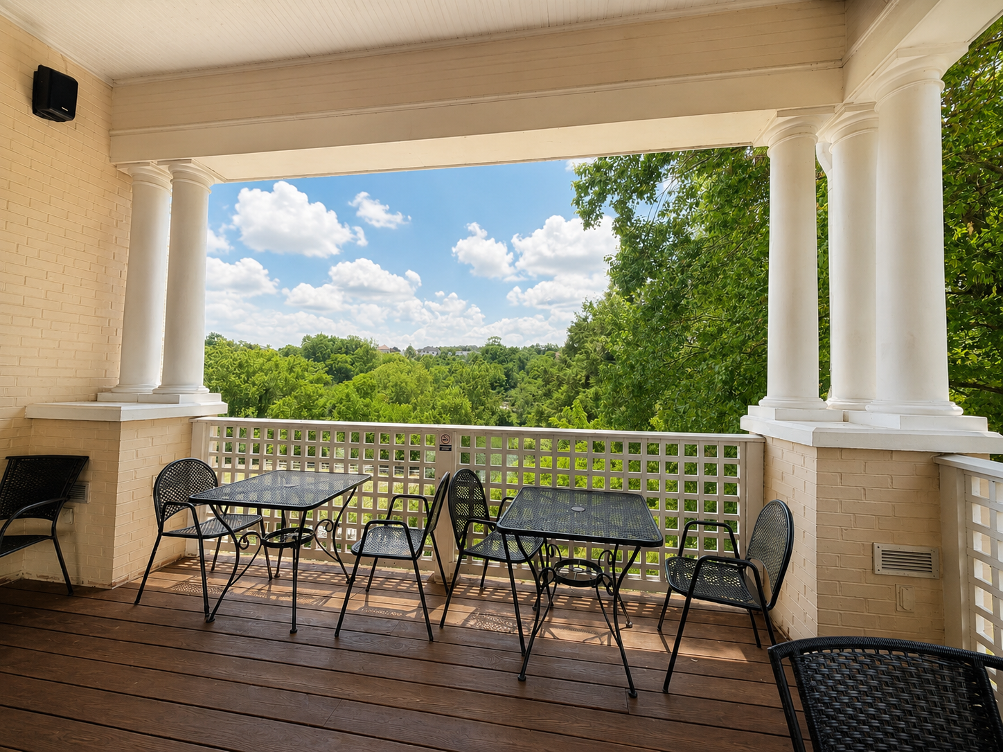 Covered patio at Fusion at Ridgefields overlooking treetops