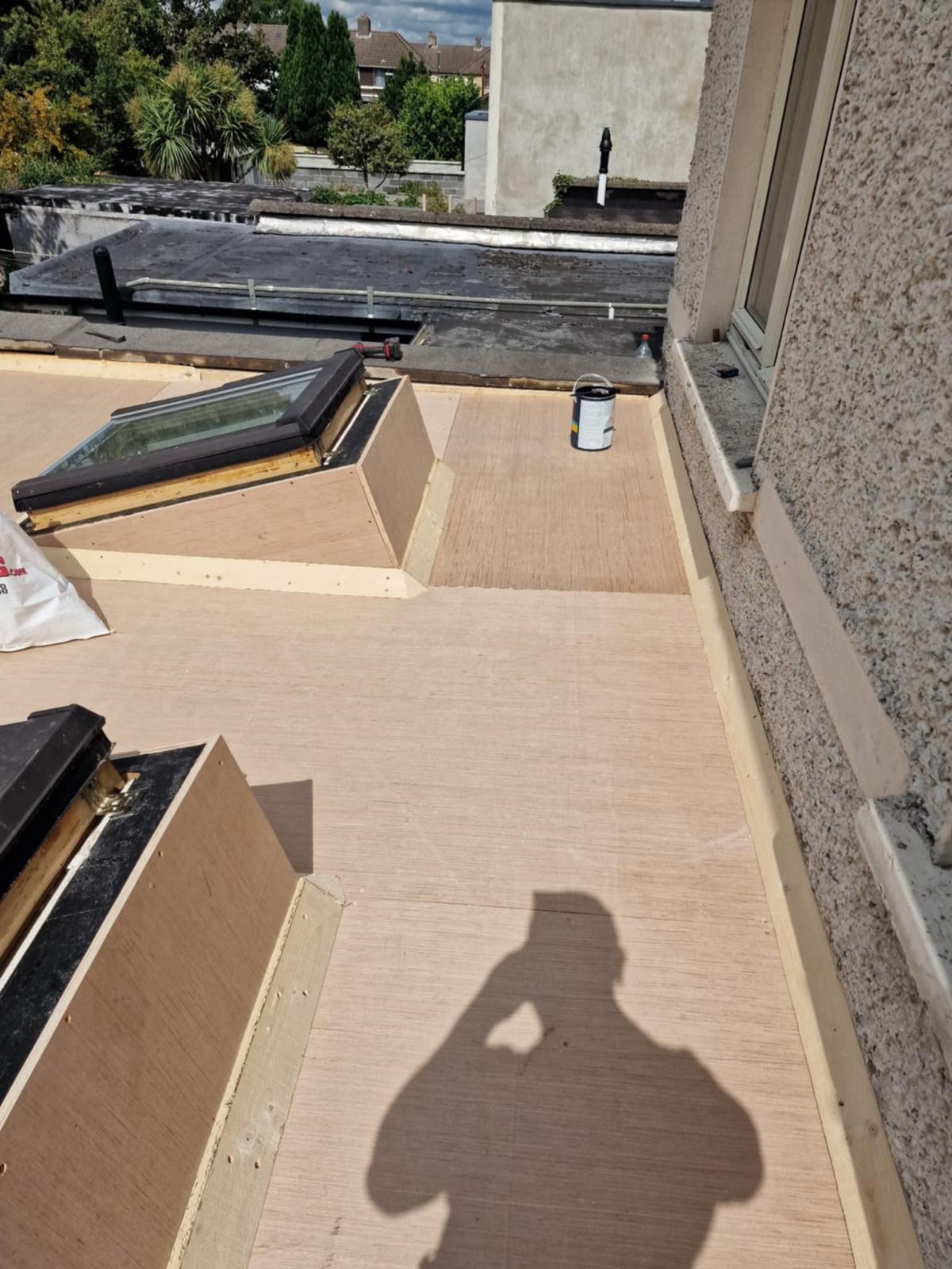 New plywood deck with timber edge battens and rooflight upstands on a flat roof in Walkinstown