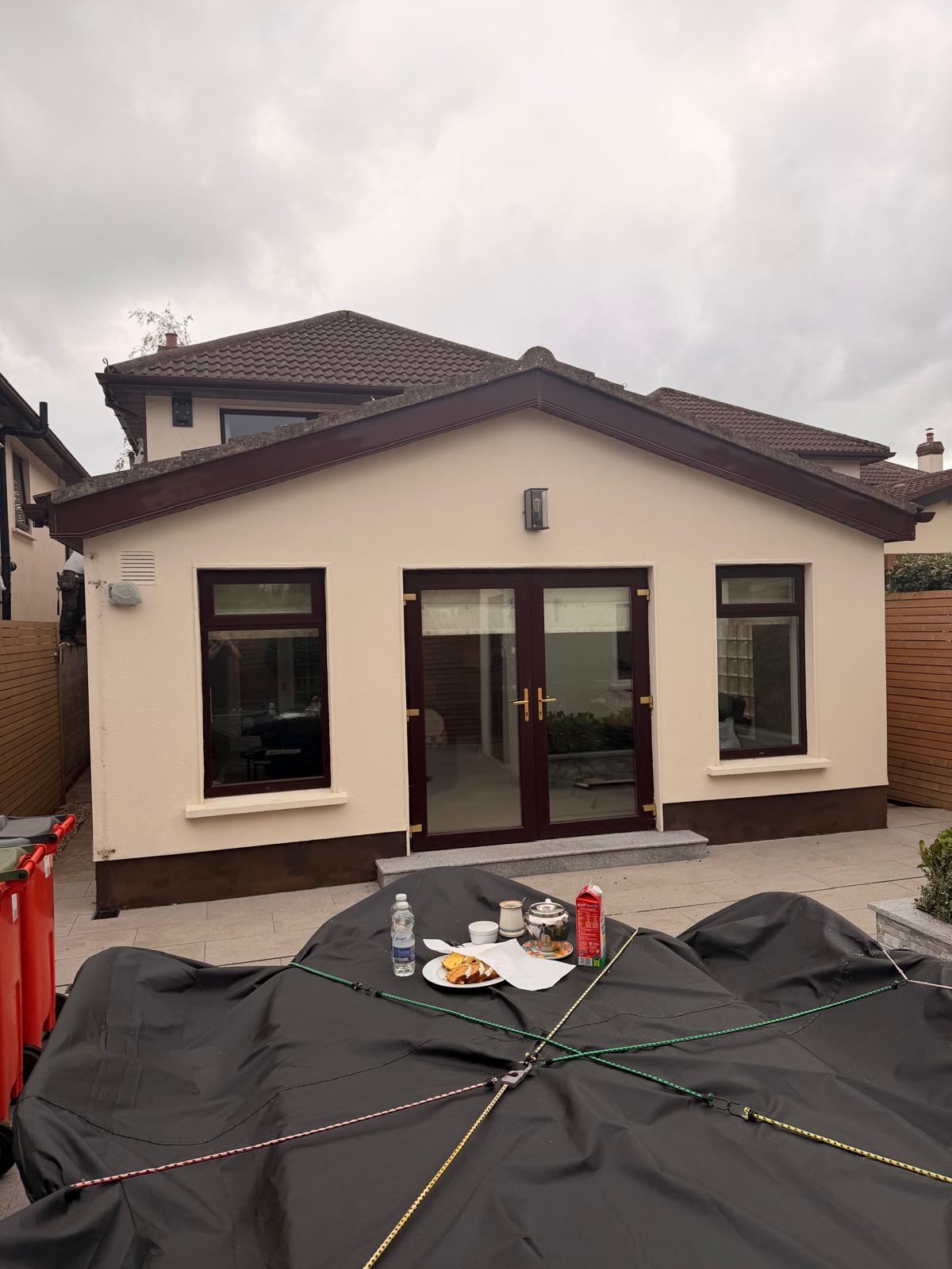 Rear elevation roofline upgrade completed on Rathfarnham home extension with new brown fascia soffit and guttering