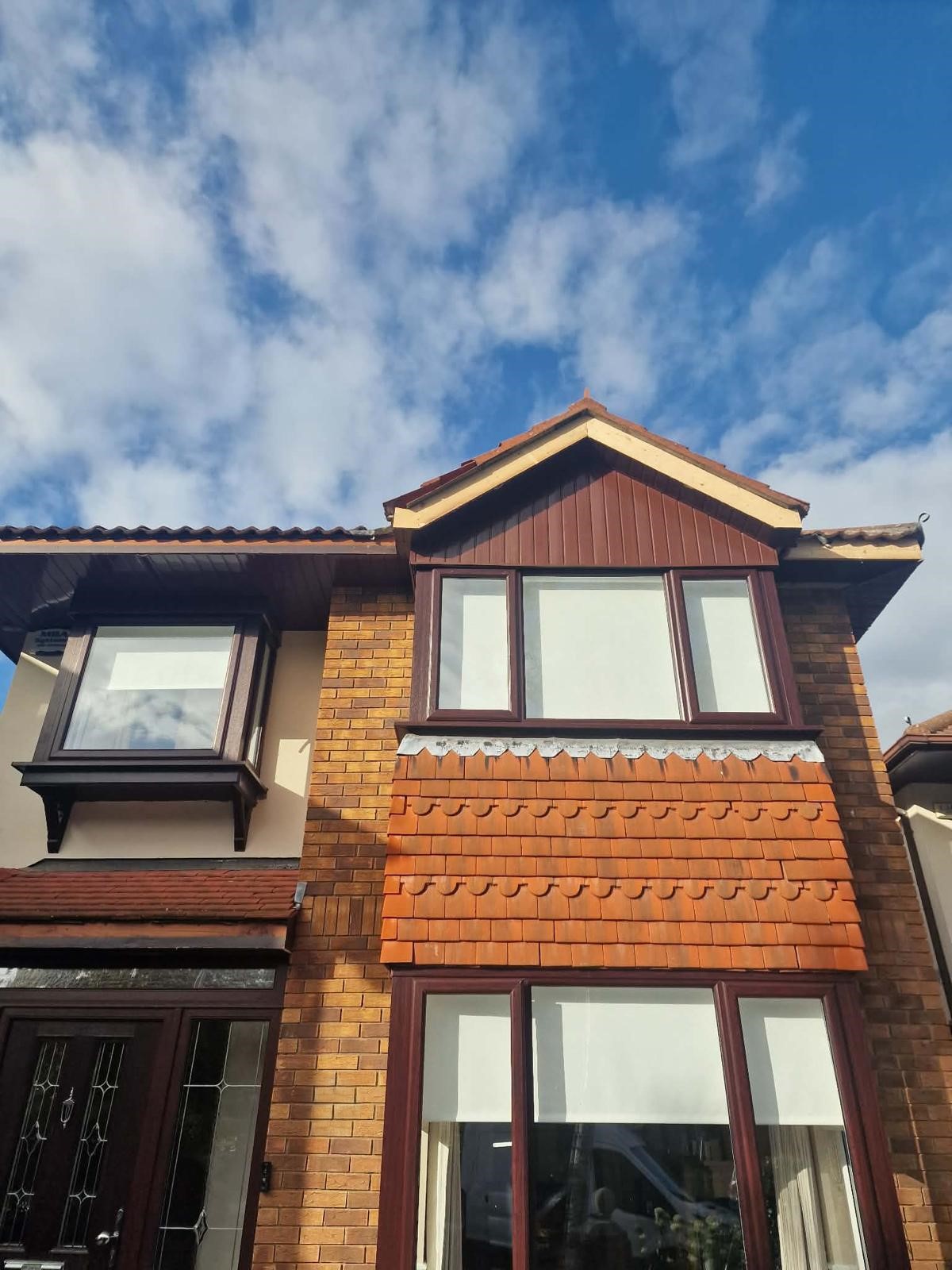 Rathfarnham property before roofline replacement showing weathered timber fascia and aging gutters