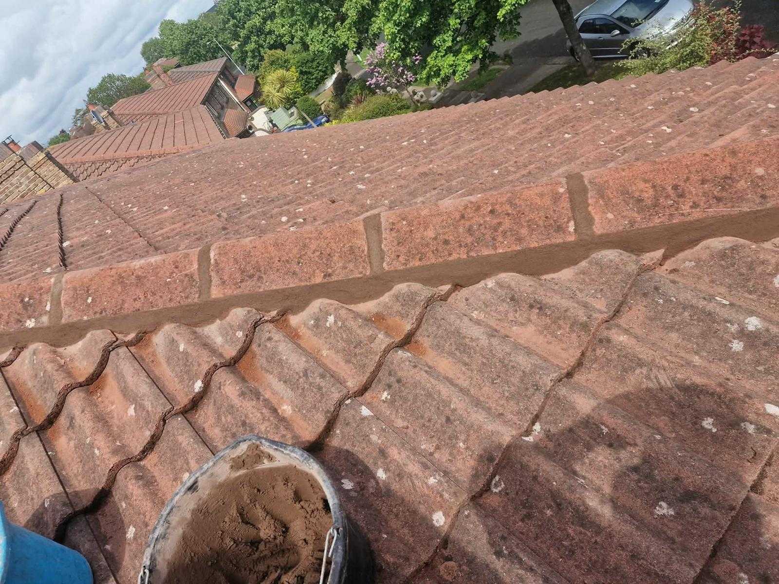 Close-up of new colour-matched mortar pointing between ridge tiles in Dundrum, Dublin 16