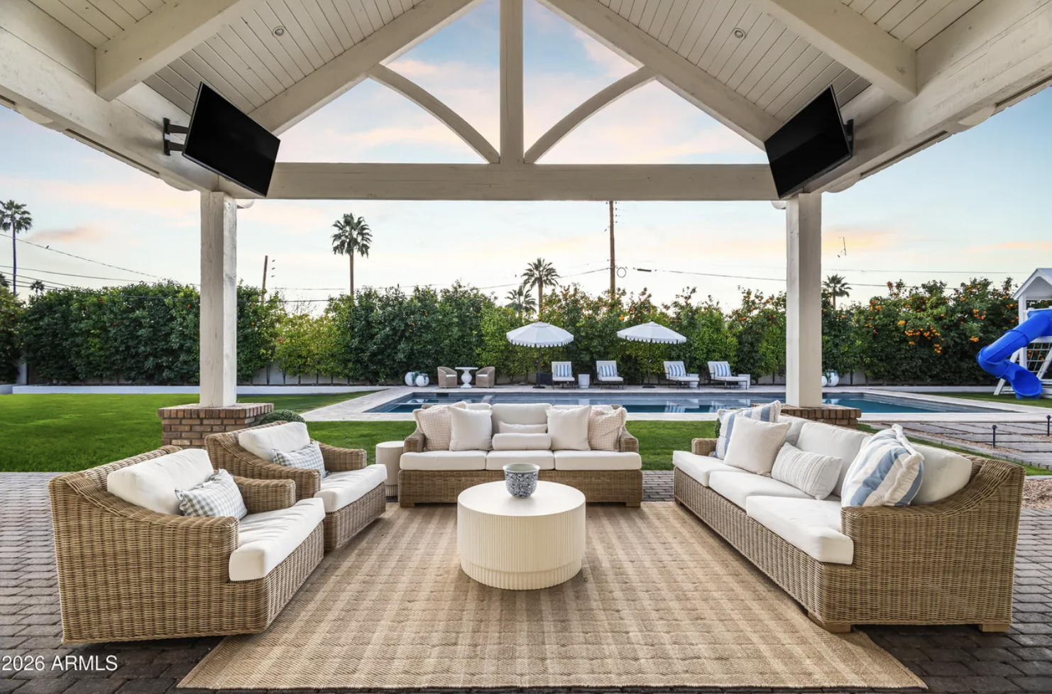 Arizona luxury outdoor living space with pool and covered patio
