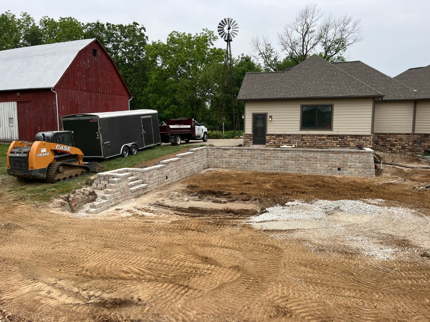 Retaining wall and patio under construction at a rural Illinois property