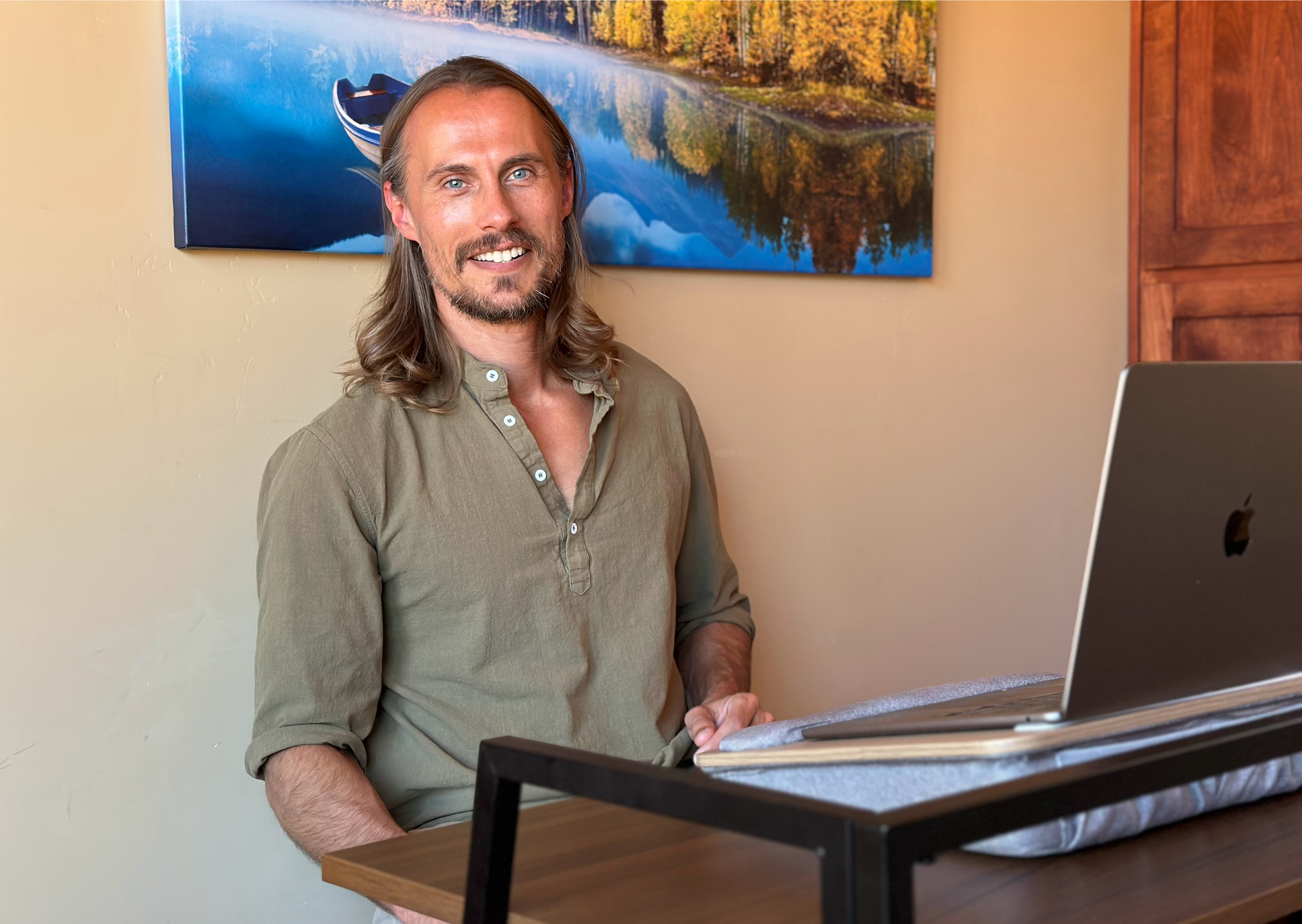 Dr. AJ Karlovich in a session setting with a laptop