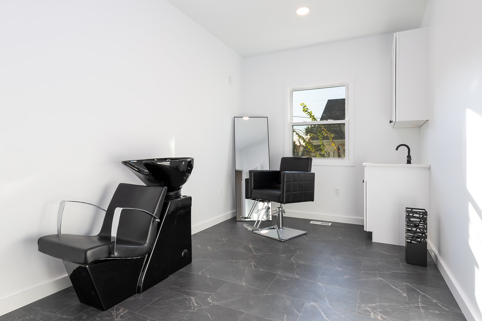 Salon suite with a large window