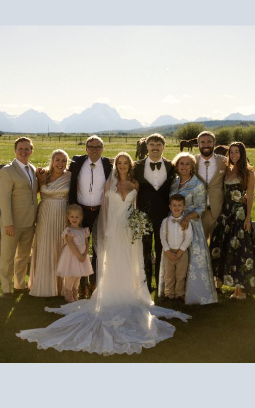 Family gathered at a wedding outdoors.