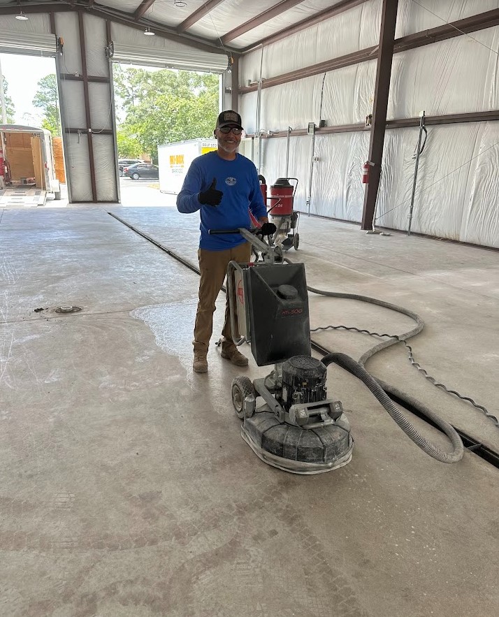 Professional applying epoxy floor coating