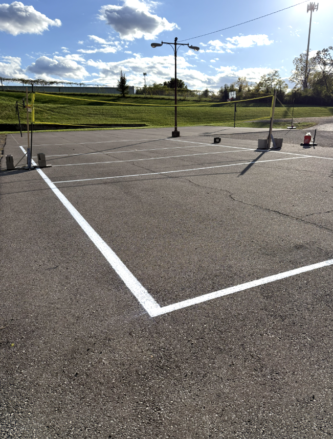 Volleyball court striping job by Stripe Plus LLC