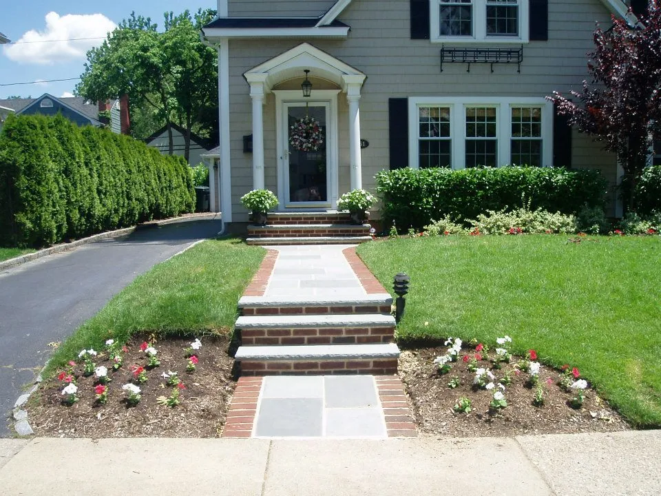 Precision masonry craftsmanship detail - bluestone and brick walkway