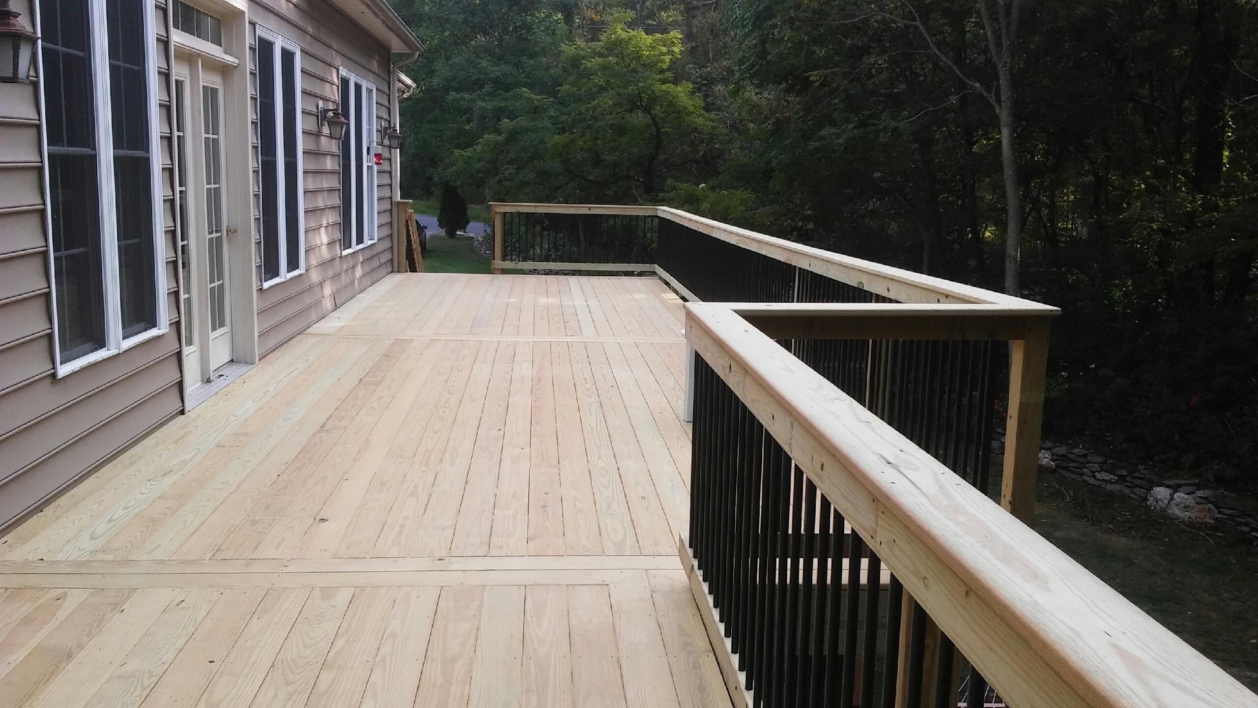 Wooden deck with black balusters