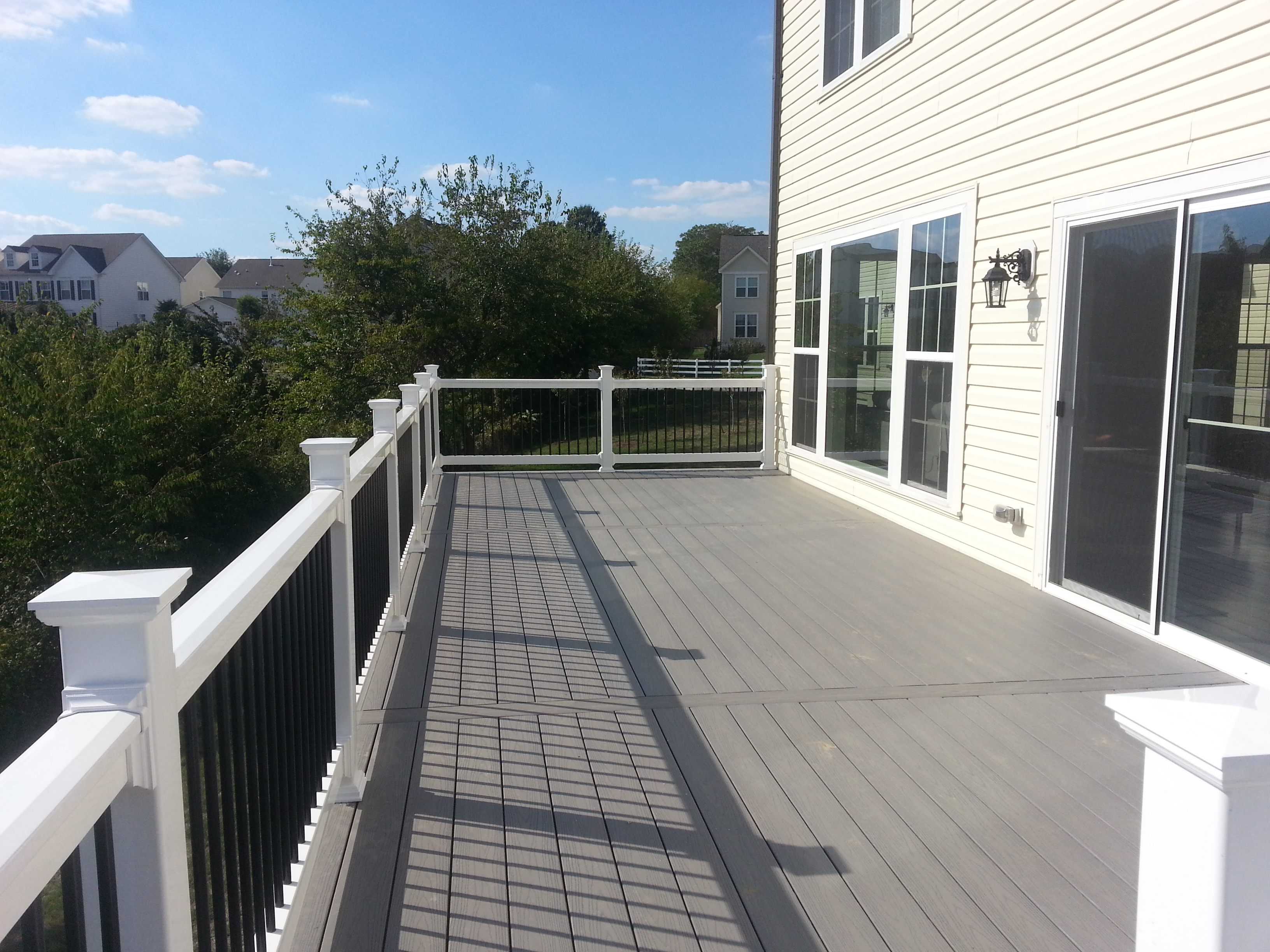 Grey deck with white railings