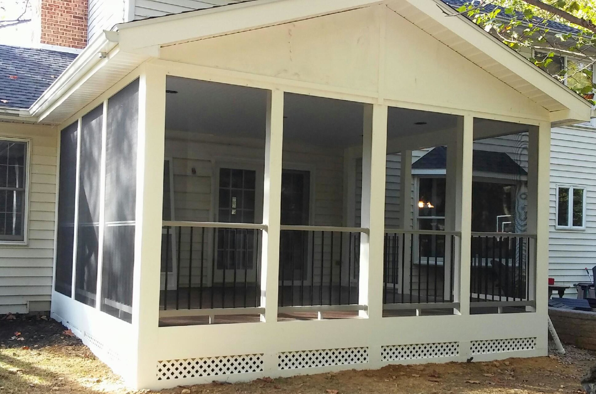 Custom screened porch with patio integration