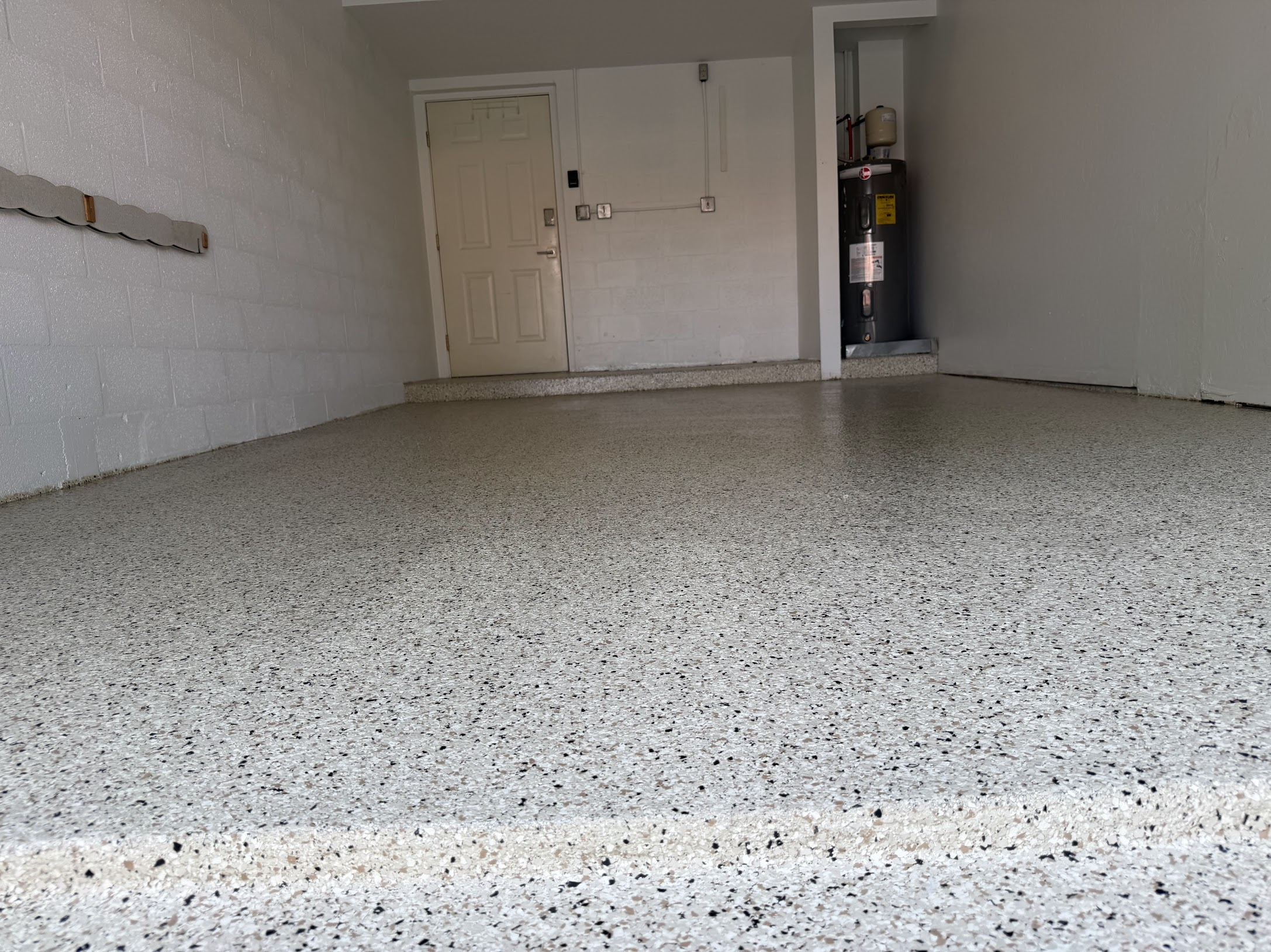 Close-up angle of durable garage flake coating floor
