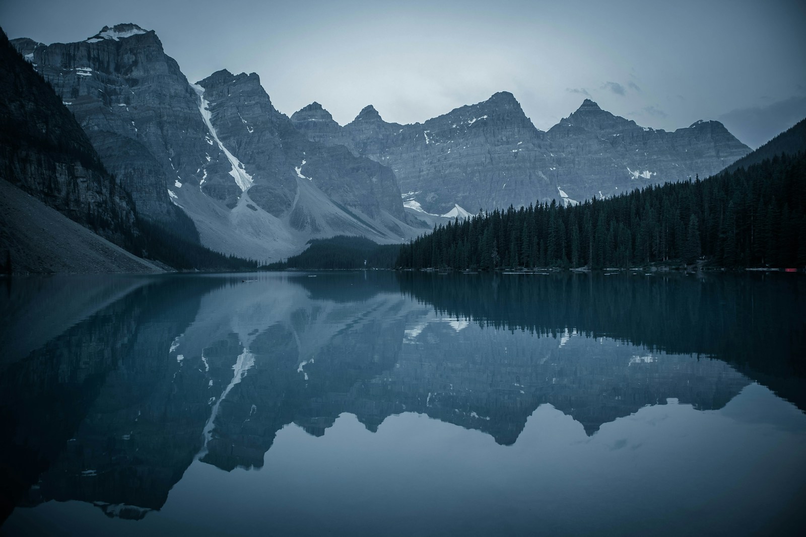 Clear mountain lake and rocky peaks