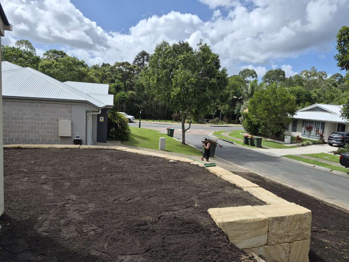 Graded site with retaining wall
