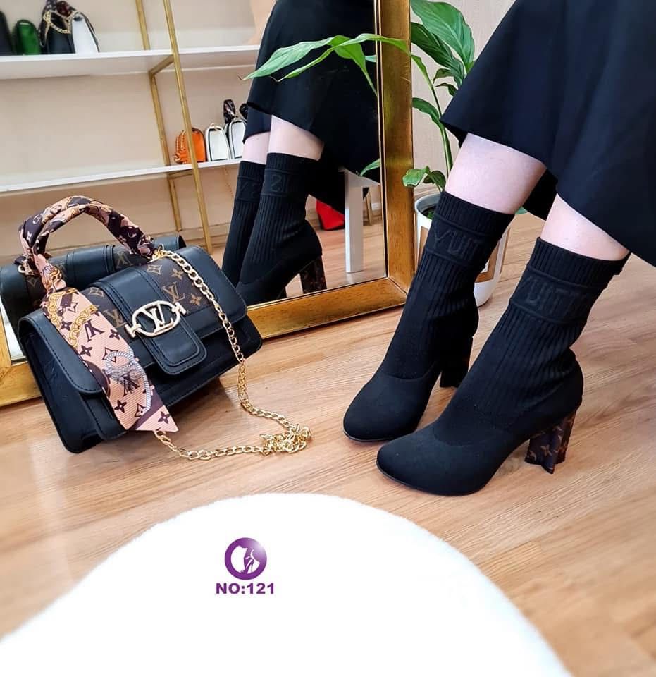 Black boots with designer bag