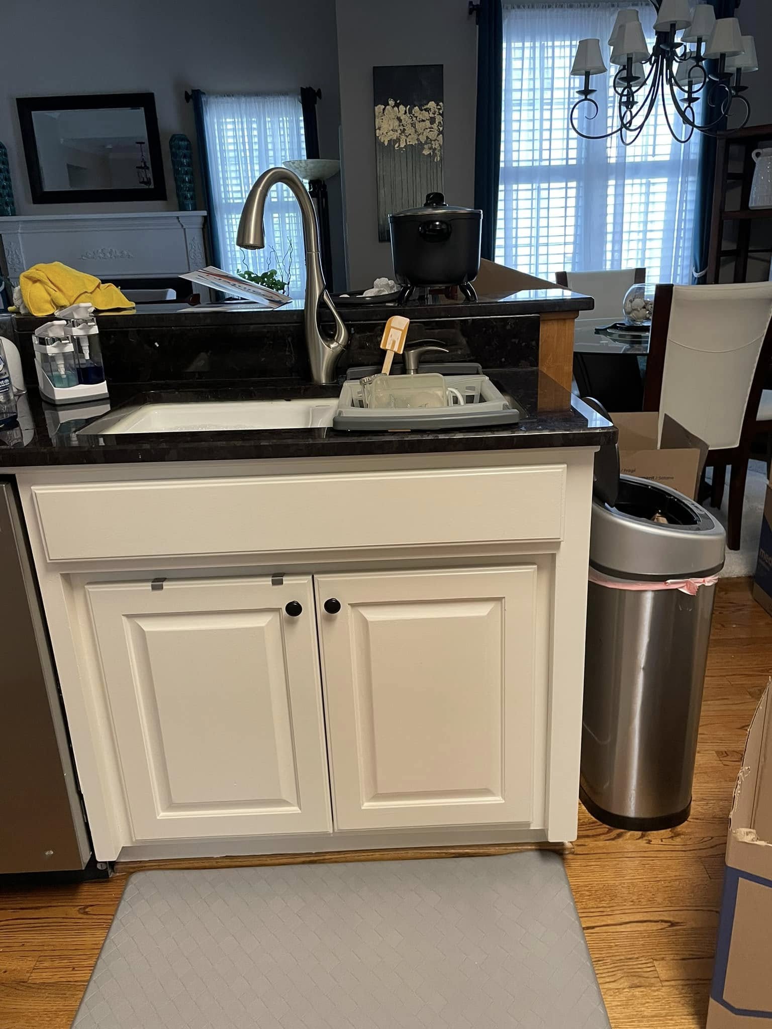 White kitchen cabinets sink view