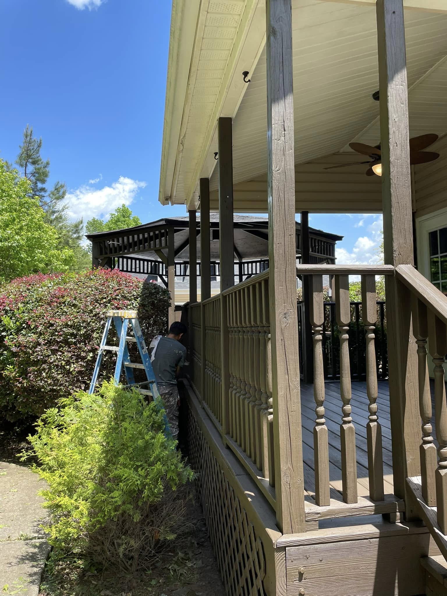 Deck staining process in progress