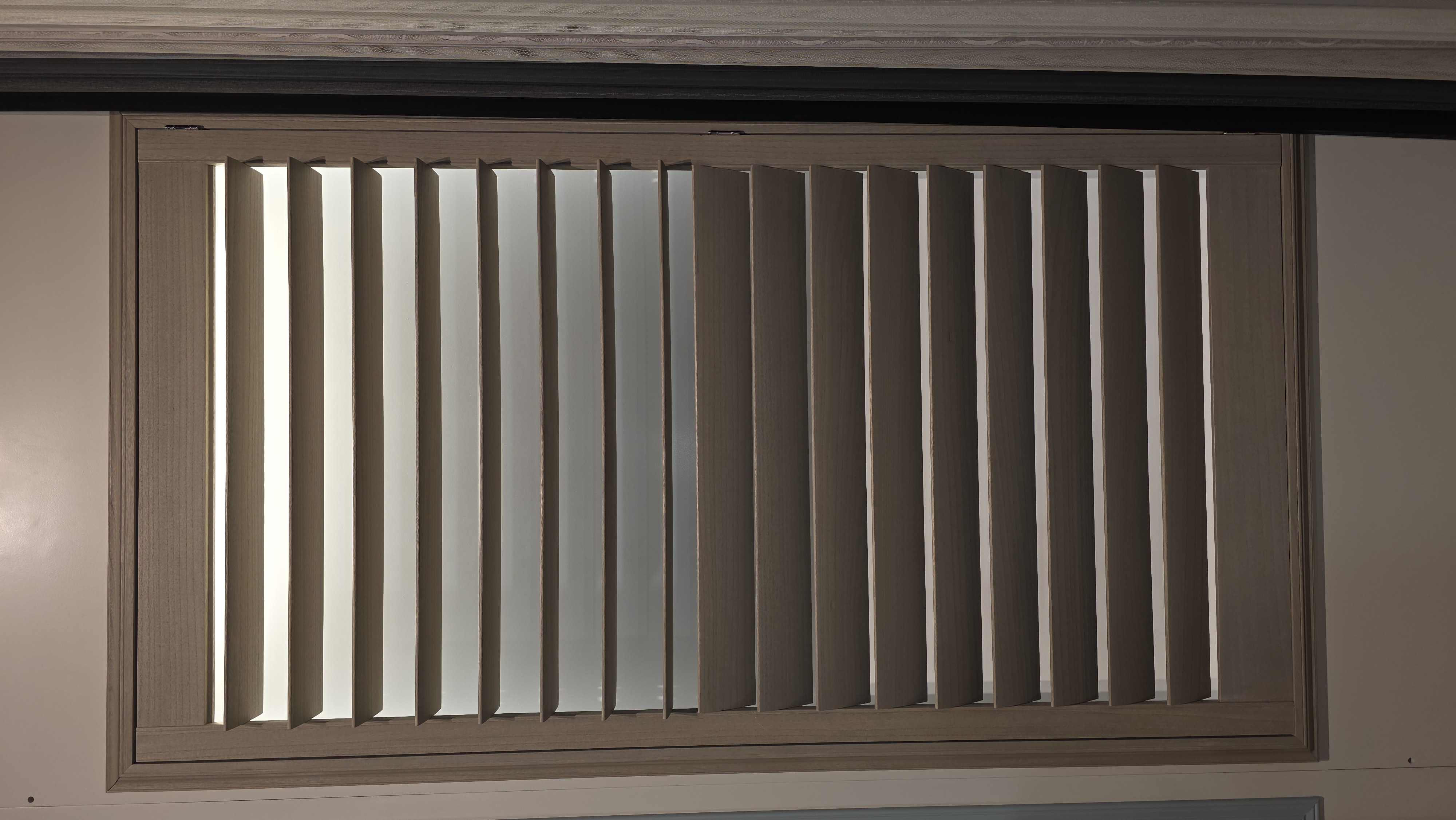 Wood-tone Norman shutter display at the Norman USA showroom
