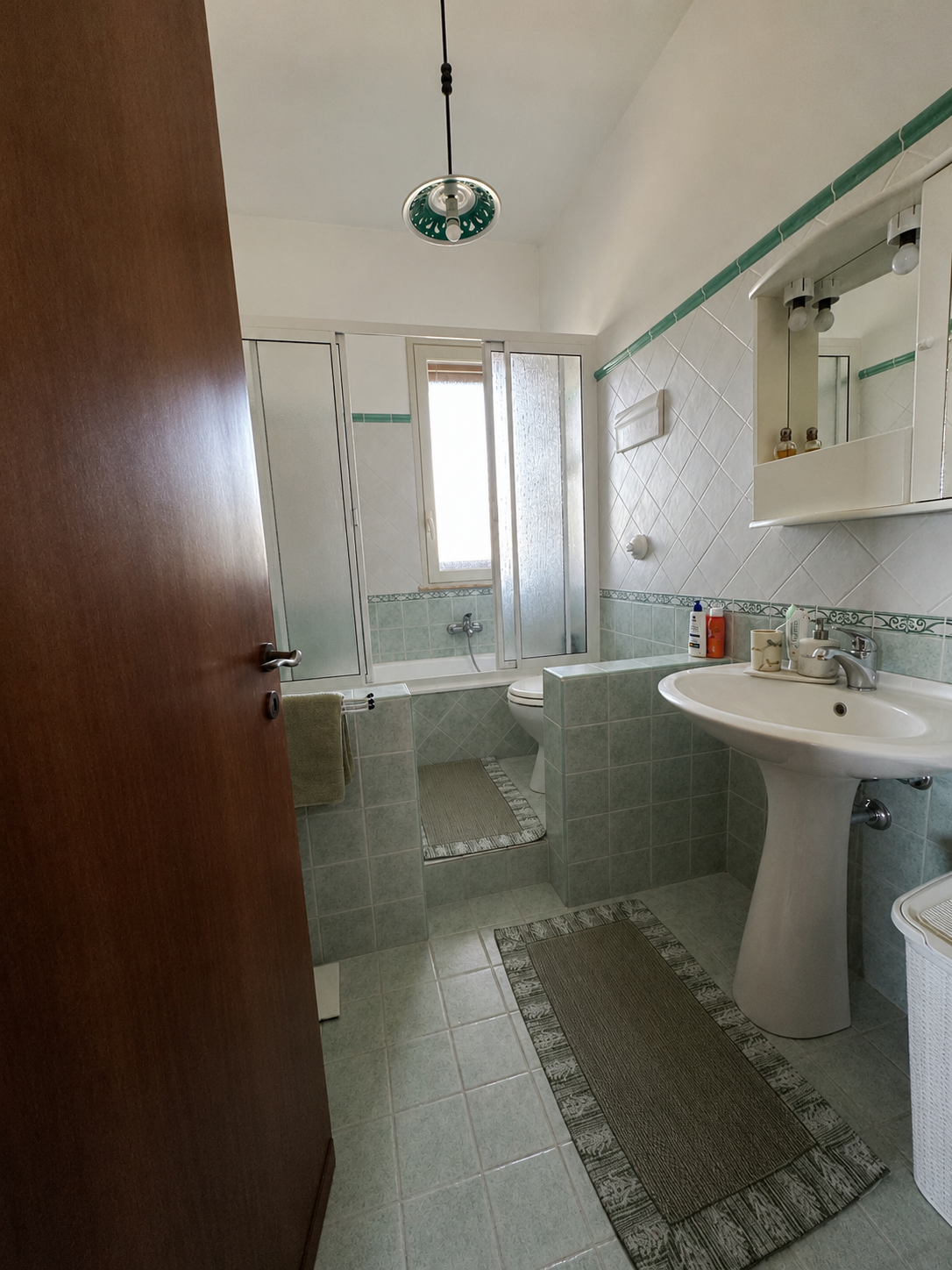 Villa Bathroom with Green Tiles