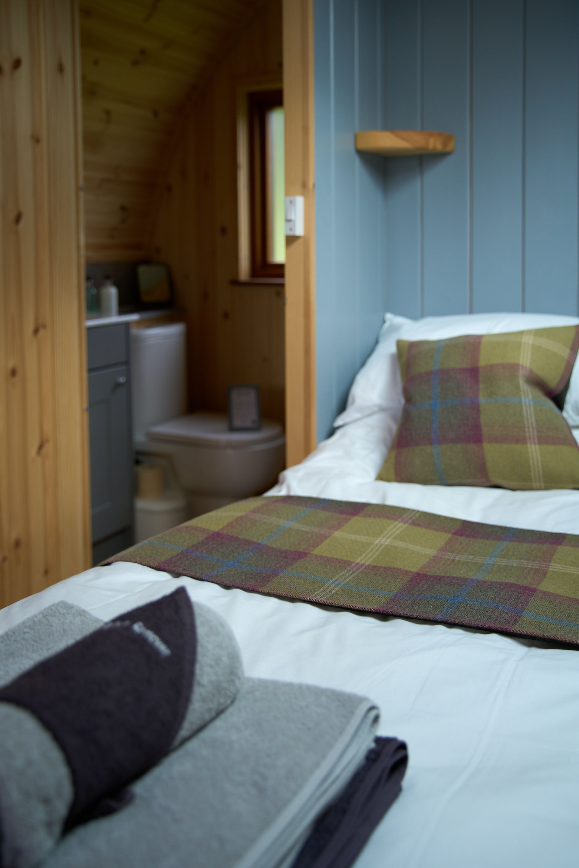 Comfortable double bed inside a luxury glamping pod