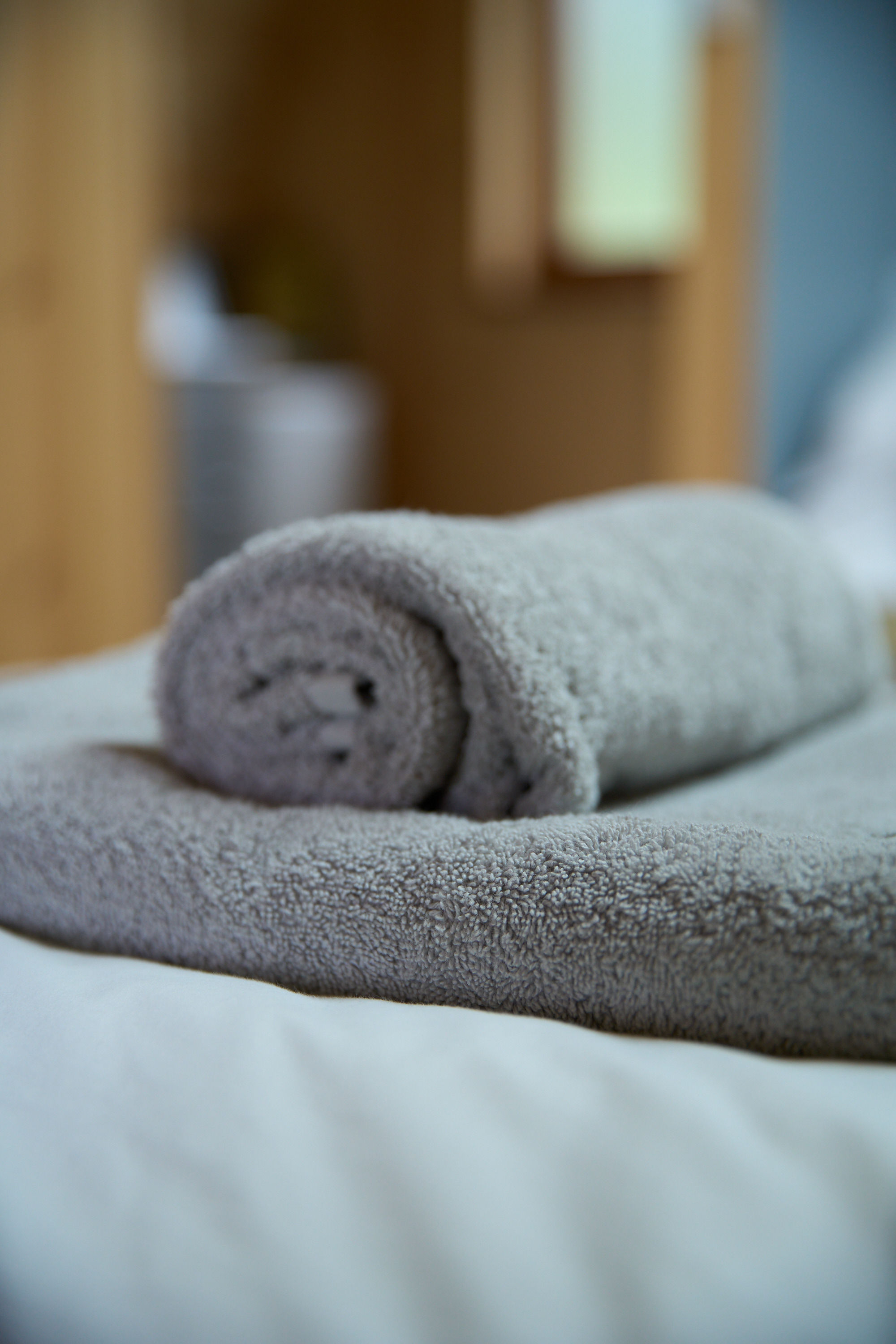 Soft, high-quality towels provided for guests in the luxury glamping pod