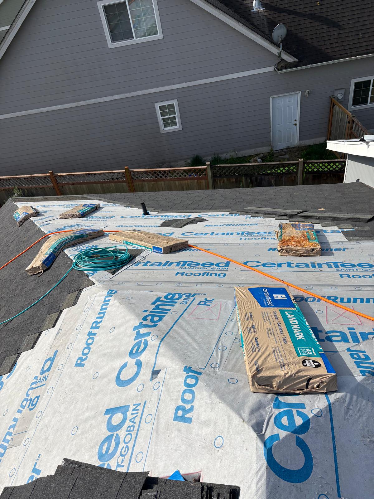 Licensed roofing contractor reviewing a written estimate with a homeowner