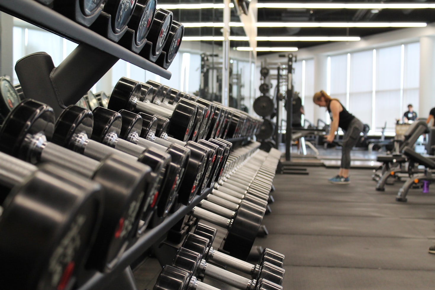 Busy gym floor with members training