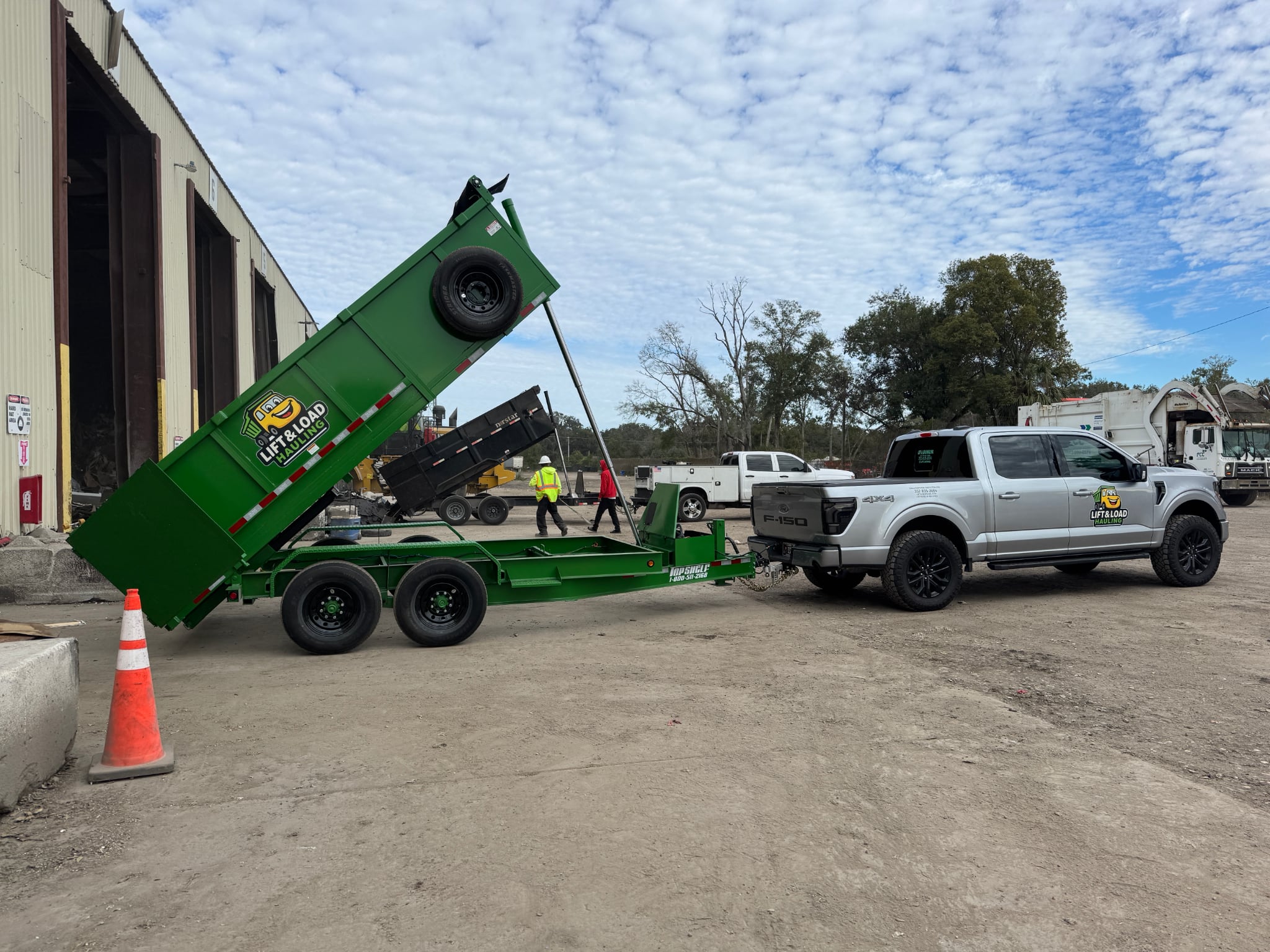 Lift & Load truck and dump trailer unloading at transfer station