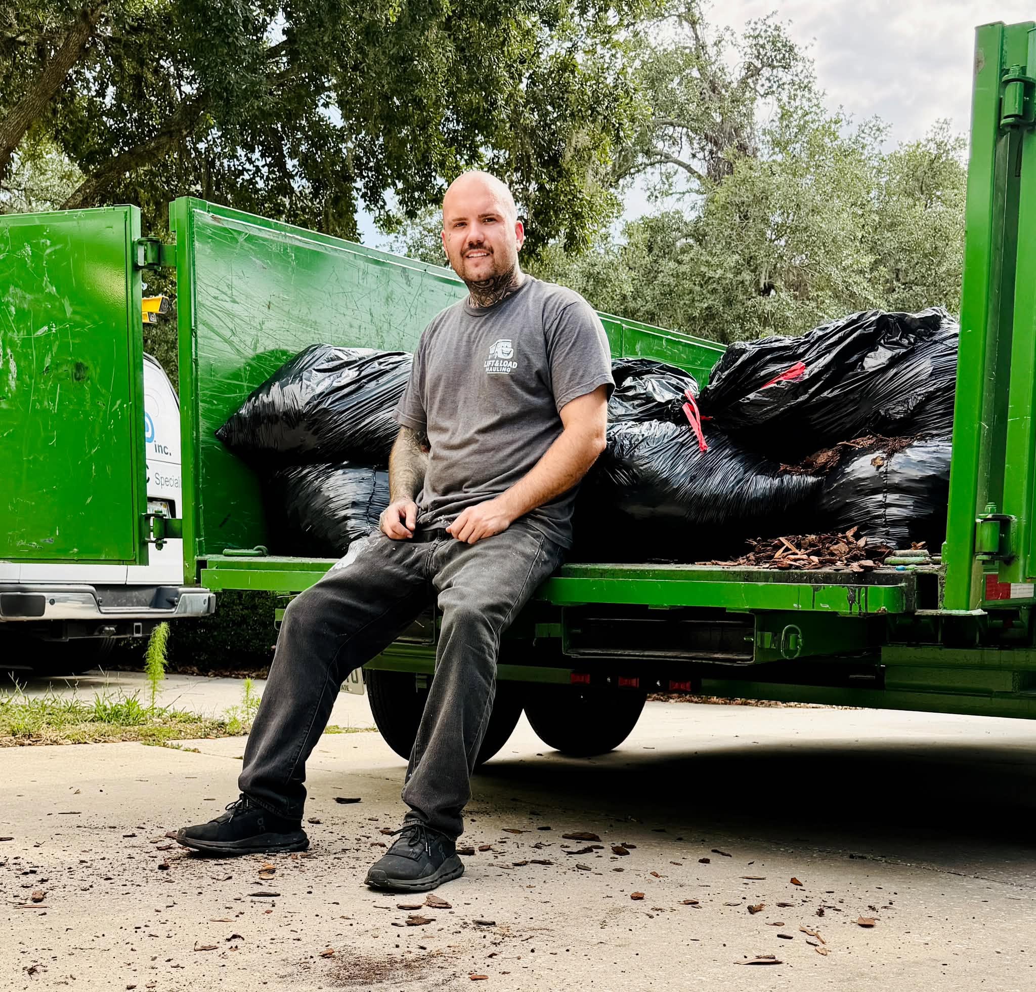 Lift & Load Hauling team member with truck