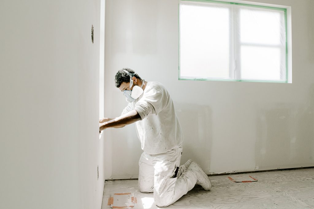 Painter working on site painting contractor Winnipeg MB