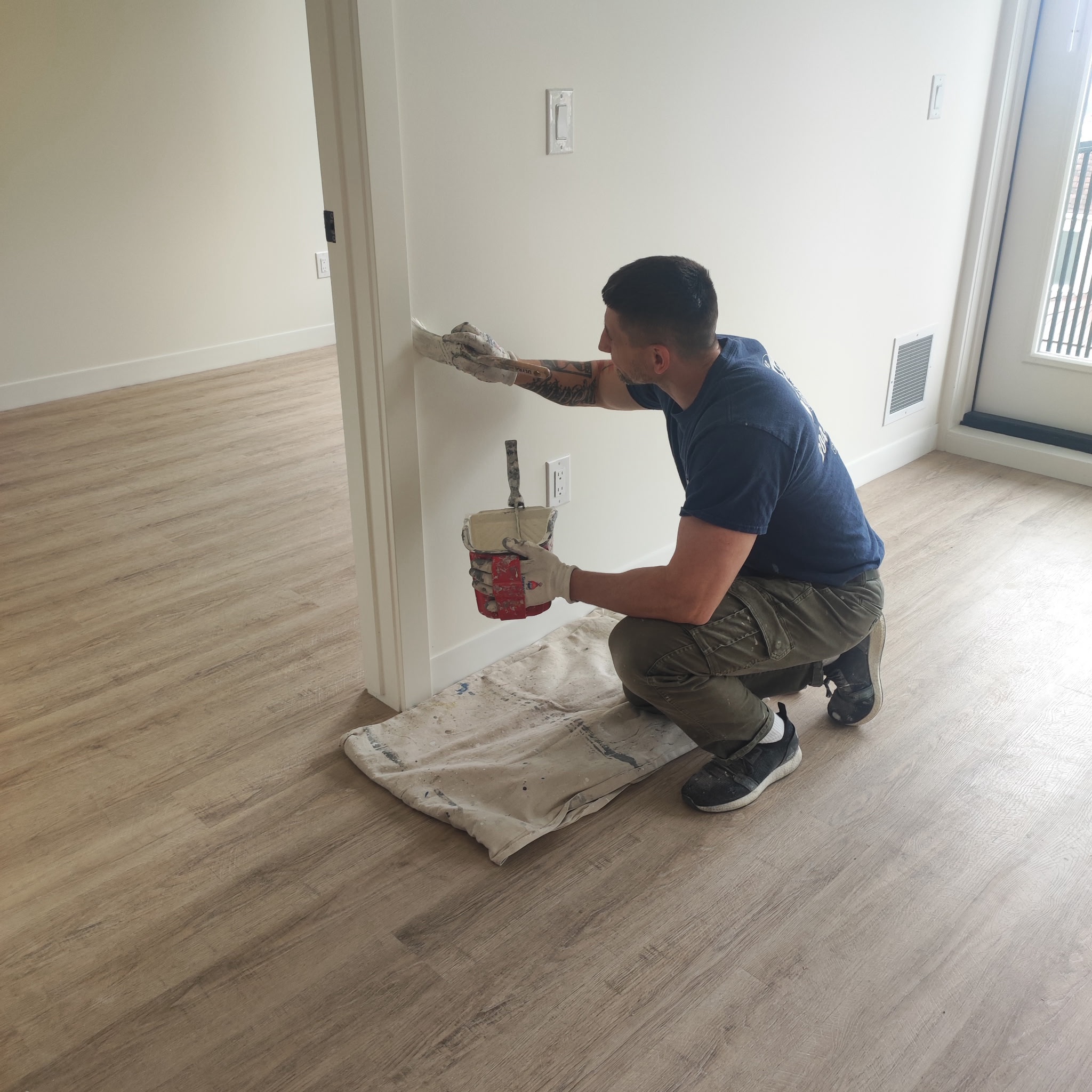 Professional painters at work painting contractor Winnipeg MB