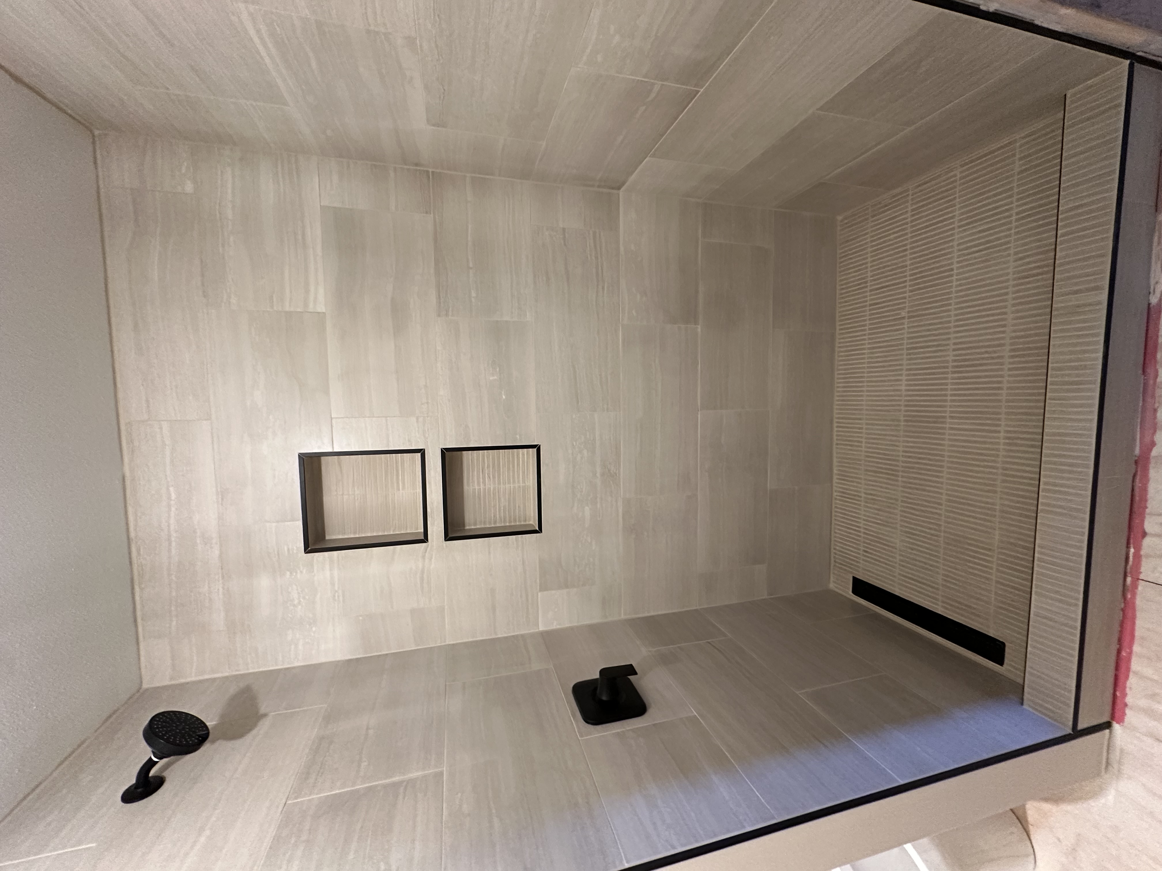 Luxury stone and tile bathroom