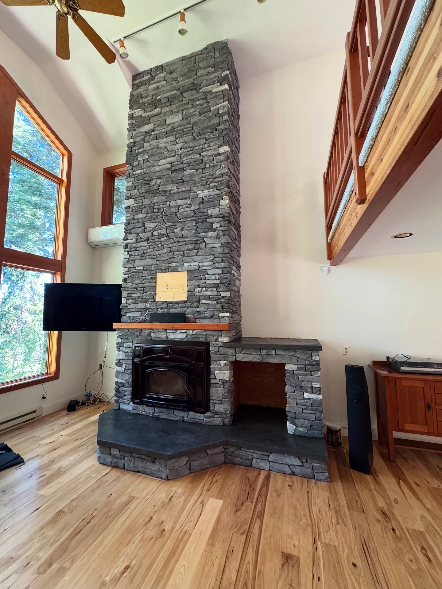 Floor-to-ceiling natural stone fireplace