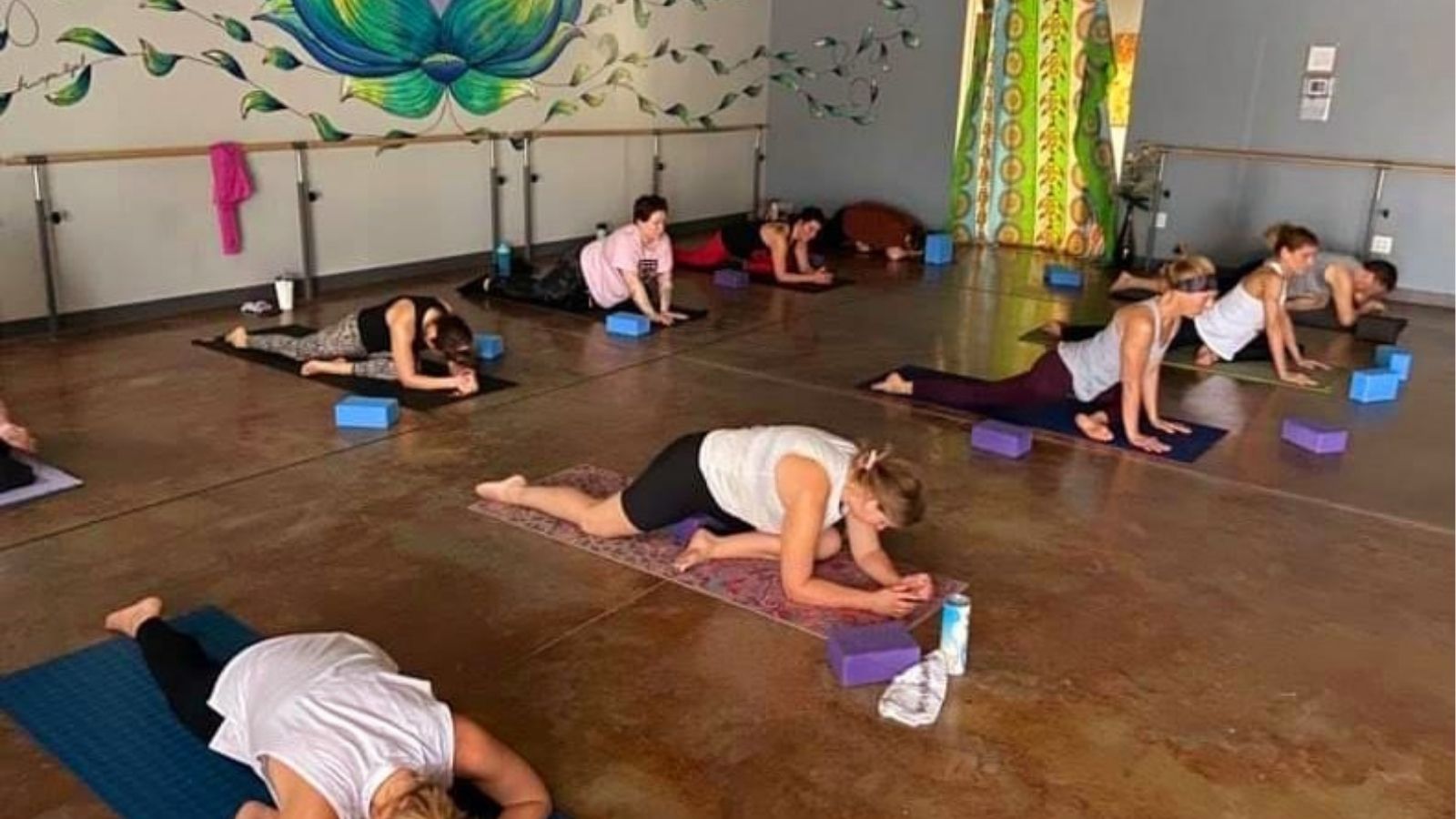 Members practicing Pilates and mobility exercises in Studio 200 at The M.A.C. in Cedar Rapids