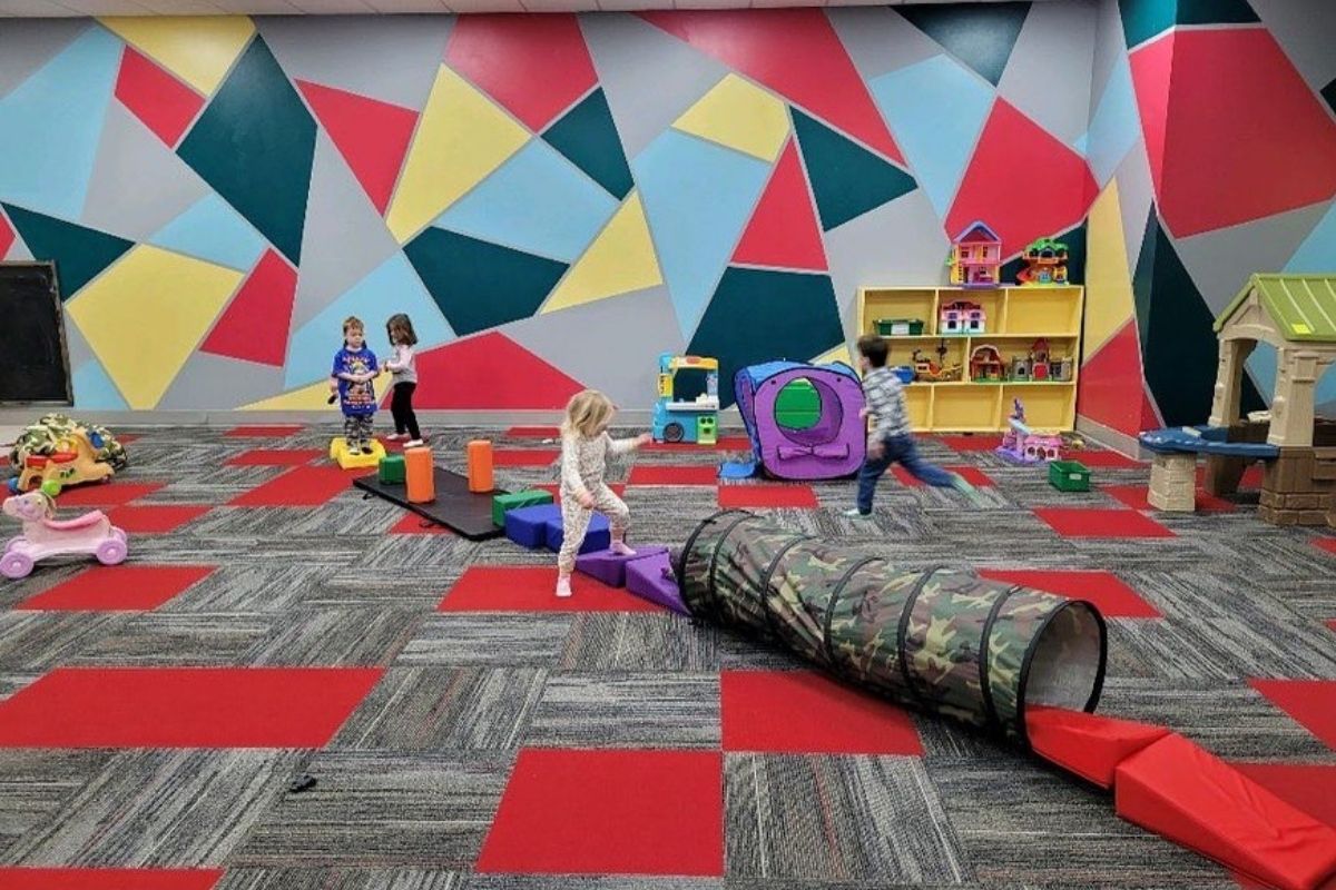 Kids enjoying supervised play in The M.A.C. Kids Club childcare area in Cedar Rapids