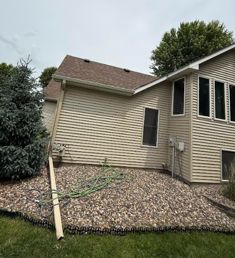 Damaged downspout separated from home