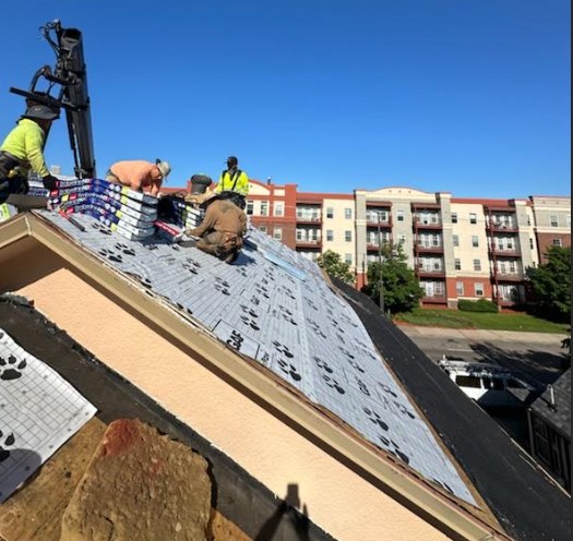 Roofing crew working on a new installation