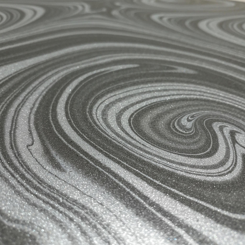 Swirled silver-and-charcoal metallic epoxy floor