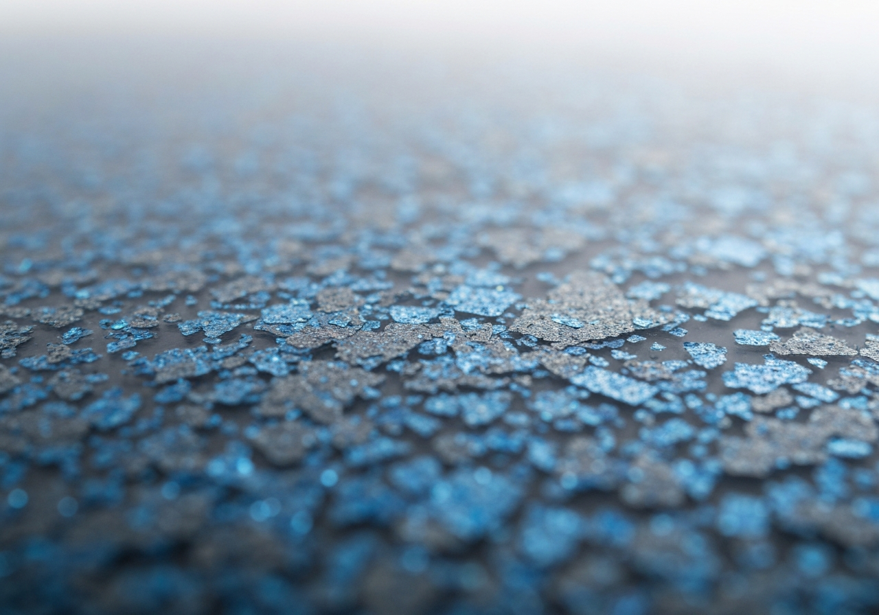 Close-up of decorative flake broadcast in a clear topcoat, blue/gray blend
