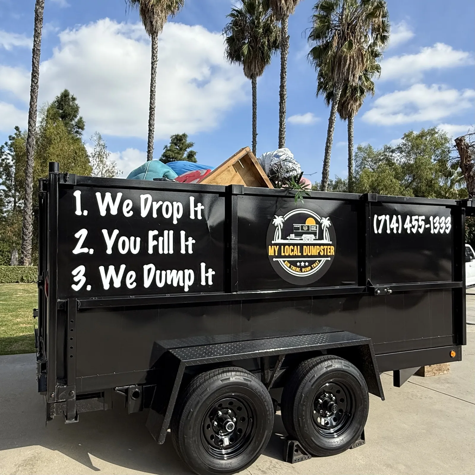 Loaded dumpster rental full of household junk and furniture in Orange County